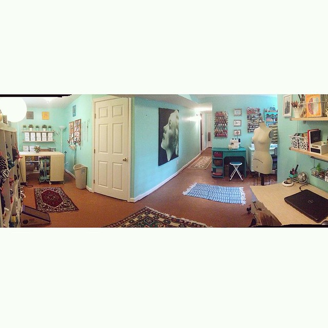 Taking photos of my sewing room is hard because it's such a funny shape! Here's a shitty panoramic to give you an idea of what I'm working with.